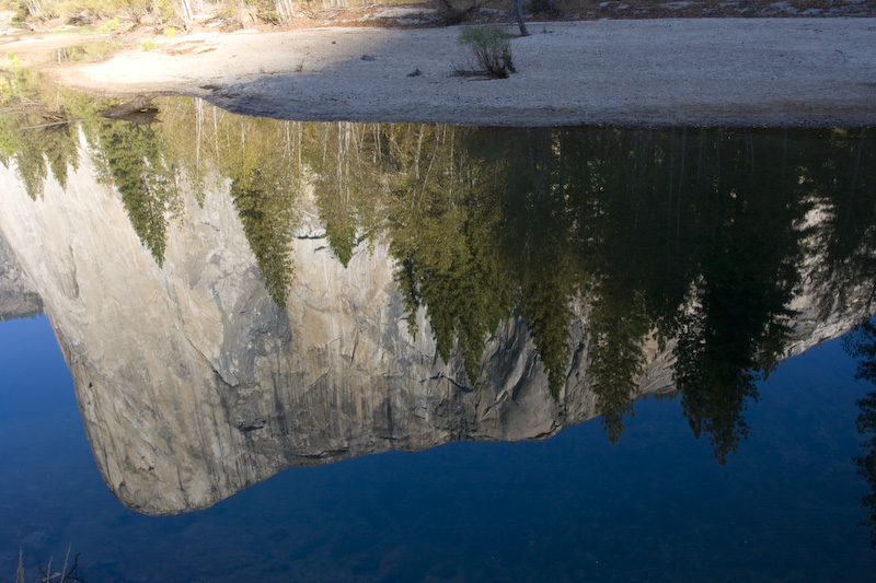 Reflection Of El Capitan In Shallows Of Merced River
